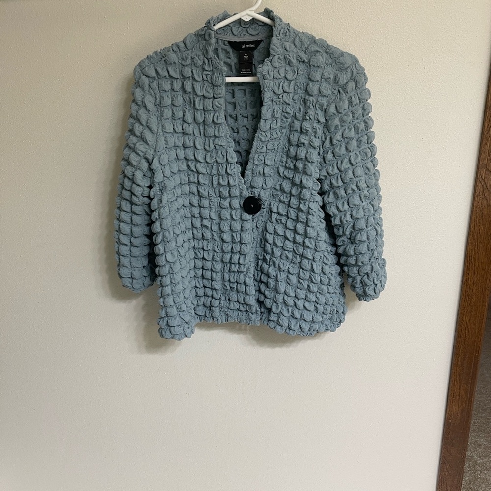 Elegant textured jacket by Ali miles.